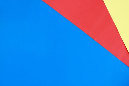 Yellow paper blue and red primary color background For the designの写真素材