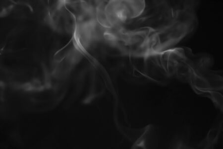White smoke blurred on a black backgroundの写真素材