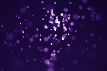 Bokeh purple proton background abstractの写真素材