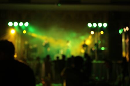 Teenage party with people blurred backgroundの写真素材