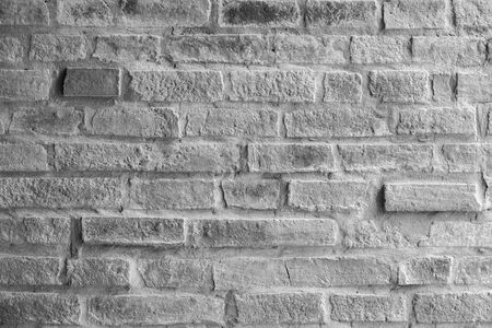 Old white brick wall, concrete backgroundの写真素材