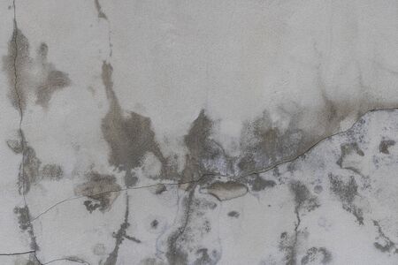 Cement walls with cracks and dirtの写真素材