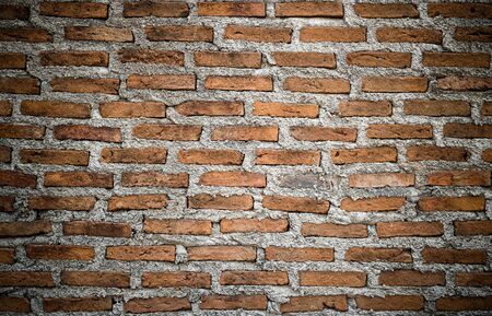 The background of the old antique brick wall, dark color, background decoration - imageの写真素材
