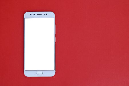 Mobile phone on a red background for design