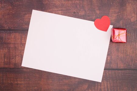 Paper heart with empty boxes and paper on wooden floors, Valentine's Day - imagesの写真素材