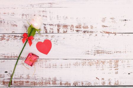 Paper hearts with red boxes and roses on white wood floors for design and in Valentines Dayの写真素材