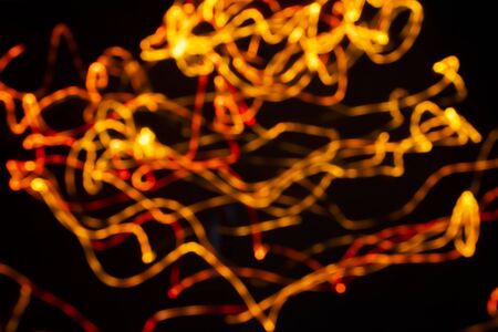 Light abstract painting in a blurred black background