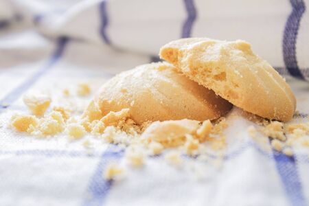 Cookies that are stacked on white fabric in the morning