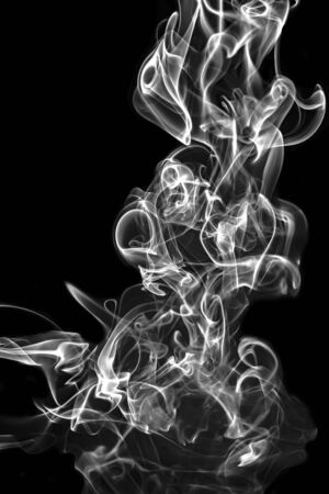 Abstract white smoke animated on a black backgroundの写真素材