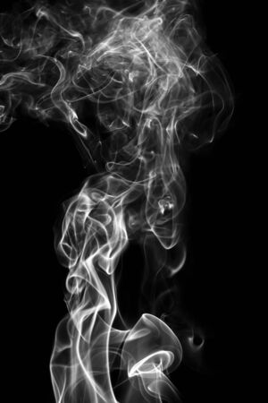 Abstract white smoke animated on a black backgroundの写真素材