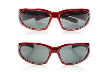Two separate red glasses on a white backgroundの写真素材