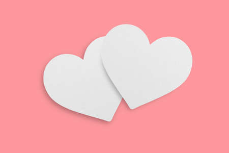 Two hearts shaped paper placed on pink background.Love concept.の写真素材