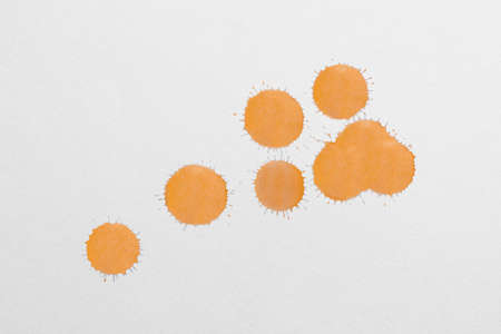 Water color dripped onto white paper in several spots. watercolorの写真素材
