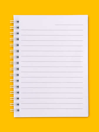 White notebook placed on yellow background.Notebook concept.の写真素材