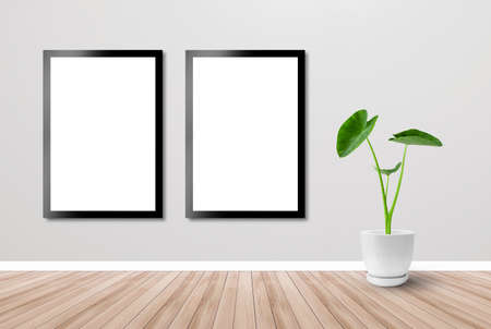 The poster is attached to the wall of the room. Photo frame and wood floor and tropical plants. Room background. Wallpaper backdrop. Design.の写真素材