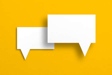 speech balloon shape white paper isolated on yellow background Communication bubbles.