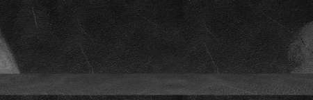 Dark black wide horizontal decorative cement wall room background with light and shadow Abstract Wallpaper Backgroundsの写真素材