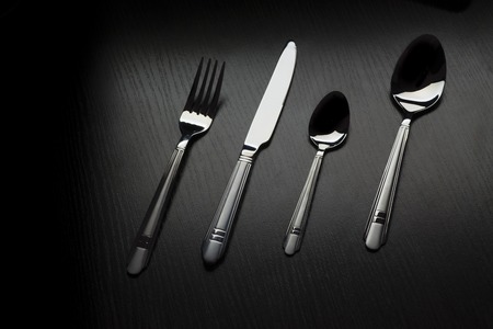 cutlery on a black table dark toneの写真素材