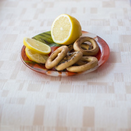 lemon cookies and tea spoon on a plateの写真素材