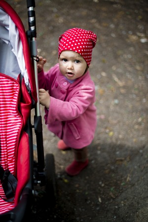 year-old girl and A red and stroller