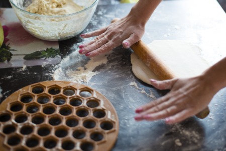 prepare the dough for dumplings unrolls dough