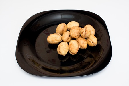 Nuts with condensed milk On a black plateの写真素材