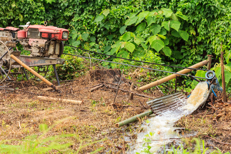 water pumps diesel engine in nature green fieldの写真素材