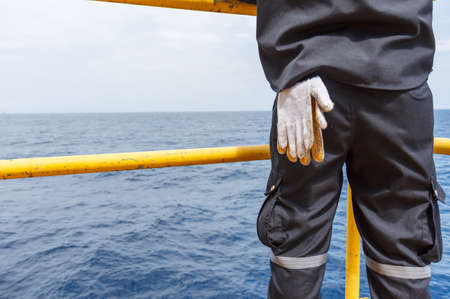 Technician observed and check operating machinery and equipment in sea off shore thailandの写真素材