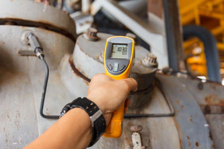 Technician observed and check operating machinery and equipment in sea off shore thailandの写真素材