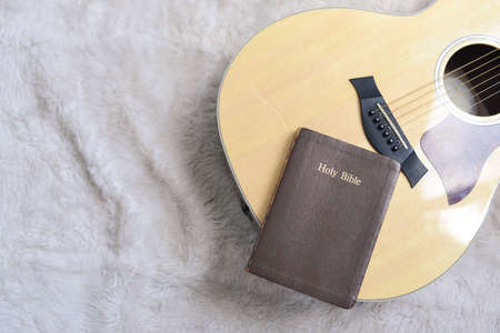 Christians worship God with a guitar with the Holy Bible. Worship of God that respects and loves our God. Christianity. religionの写真素材