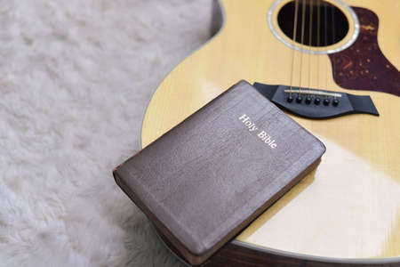 Christians worship God with a guitar with the Holy Bible. Worship of God that respects and loves our God. Christianity. religionの写真素材