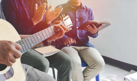 Christian family worship God in home, with a guitar and the Holy Bible. praise and worship conceptの写真素材