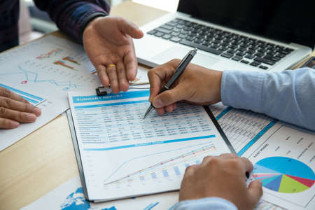 Image of two young businessmen using touchpad at meeting consultant lawyer concept.