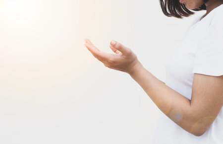 Woman hands praying for blessing from god. Concept for faith.の写真素材