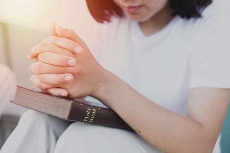 Woman prayer on bible, worship and religion. concept for faith, old Bible. copy spaceの写真素材