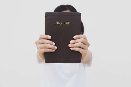 Woman prayer on bible, worship and religion. concept for faith, old Bible. copy spaceの写真素材
