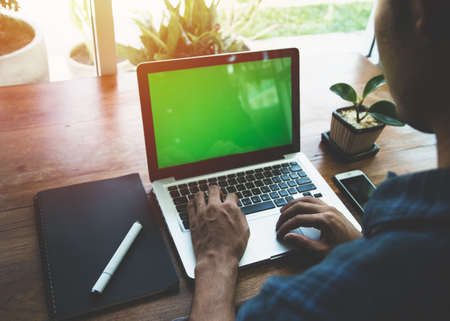 Business man working at office with laptop, close up of hands of business man.の写真素材