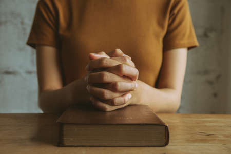 Woman prayer on bible, worship and religion. concept for faith, old Bible. copy spaceの写真素材