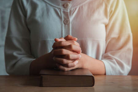 Woman prayer on bible, worship and religion. concept for faith, old Bible. copy spaceの写真素材