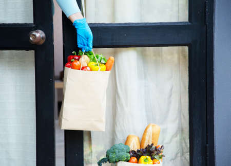 Food service providers wear masks. Stay at home reduce the spread of the covid-19 virus.の写真素材