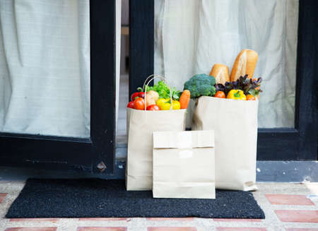 Food service providers wear masks. Stay at home reduce the spread of the covid-19 virus.の写真素材