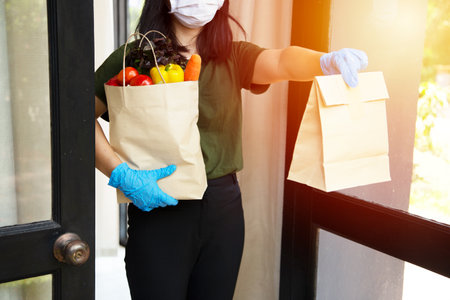 Food service providers wear masks. Stay at home reduce the spread of the covid-19 virus.