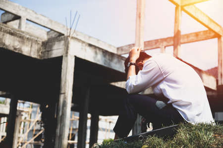 Asian businessman professional failed or upset with hand on head. Image of Stressed businessman concept.の写真素材