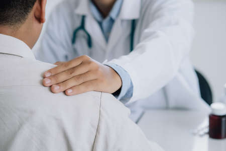 Man Visits Doctor's Office Suffering With Depression. PTSD Mental health concept.の写真素材