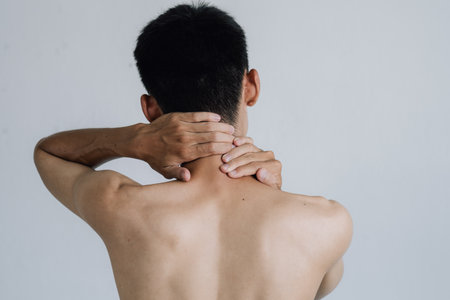 Office syndrome Concept. Young man suffering from neck pain. Headache pain. Health concept.の写真素材