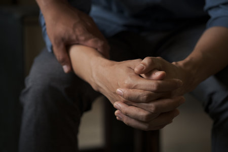Christian couple holding hands. Two people are praying together. pray together, Hands folded in prayer concept for faithの写真素材