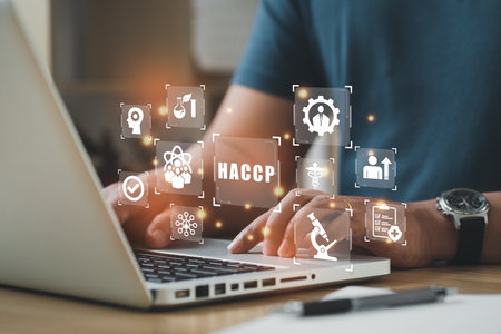 Businessman using a computer to HACCP - Hazard Analysis and Critical Control Points, Management system in which food safety.の写真素材