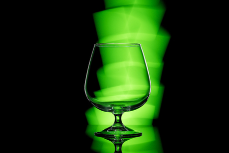 wineglass with green lightの写真素材