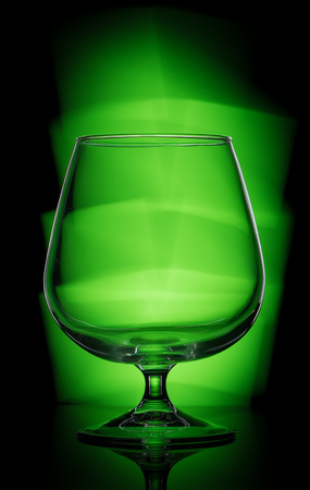 wine glass with green lightingの写真素材