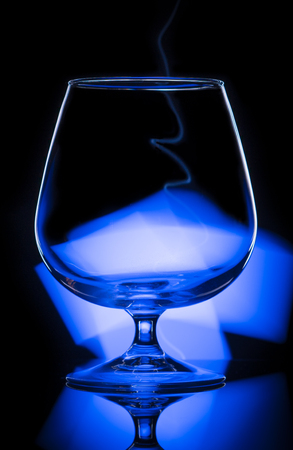 Wine glass with blue backlightの写真素材